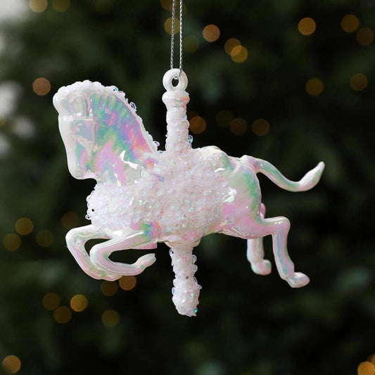 White iridescent rocking horse ornament with glitter details and hanging loop