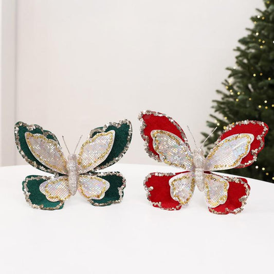 Double-layer sequin butterfly ornaments, one dark green and one red, each with glitter loop