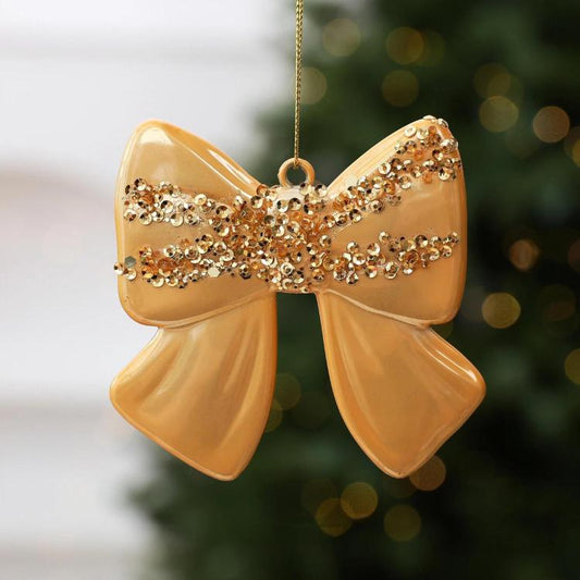 Gold bow hanging ornament with sequined center stripe and top hanging loop