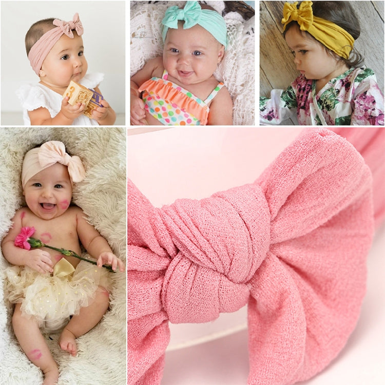 Infant hair bow headband in dusty pink with large bow