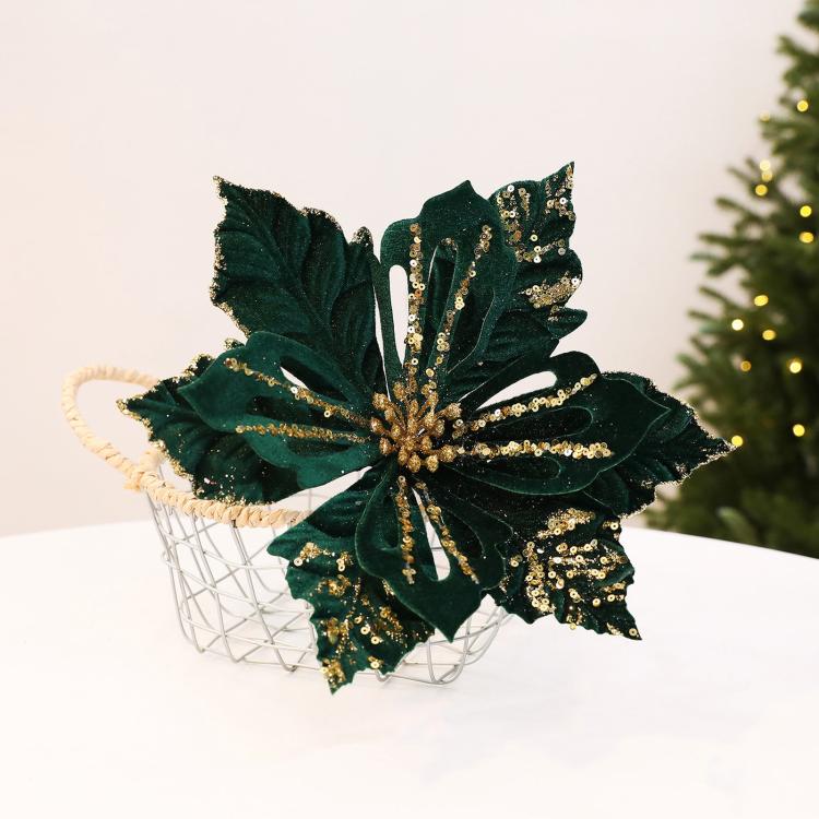 Dark green velvet poinsettia flower decoration with glittery accents, holiday DIY prop