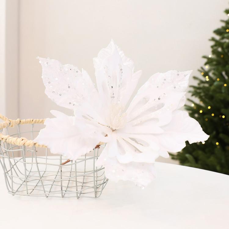 White velvet poinsettia flower decoration with glittery accents, holiday DIY prop
