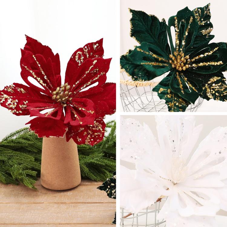 Set of red, dark green, and white velvet poinsettia flower decorations with glittery accents