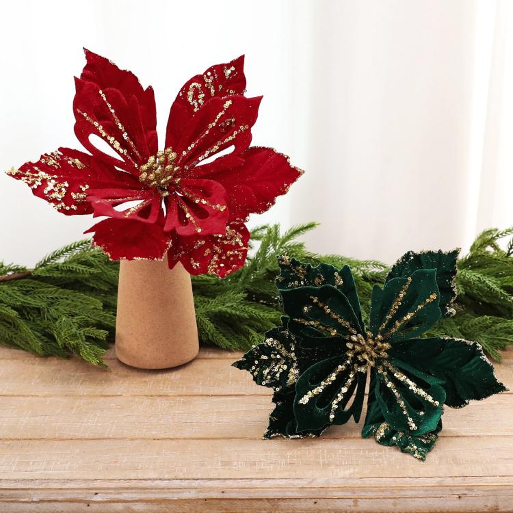 Velvet poinsettia flower decoration with gold glitter accents in red and dark green