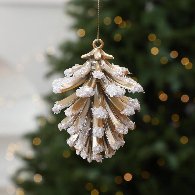 Gold-and-white pinecone-style Christmas tree ornament with hanging loop