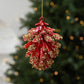 Red-and-gold pinecone-style Christmas tree ornament with hanging loop