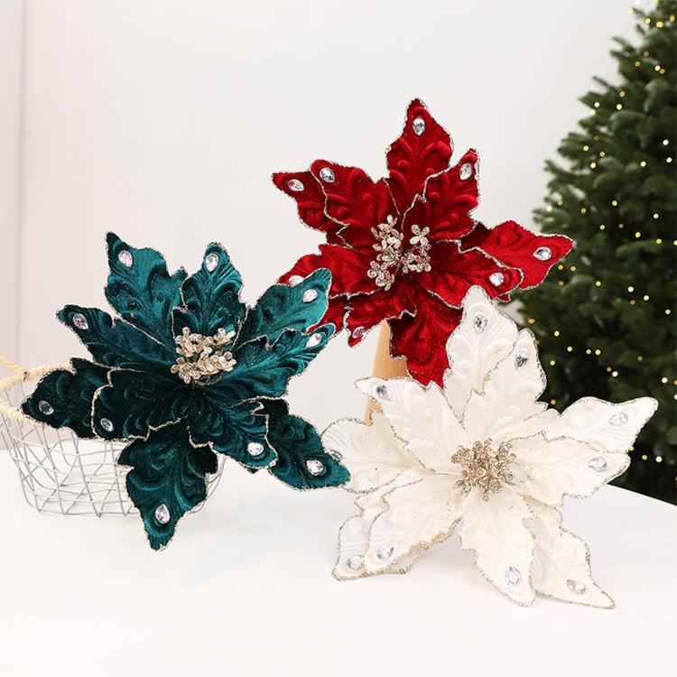 Set of red, teal, and white velvet poinsettia ornaments with rhinestone accents