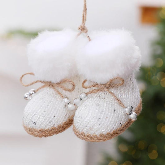 White knitted boot ornament with fluffy cuff, jute trim, and bead accents, hanging loop