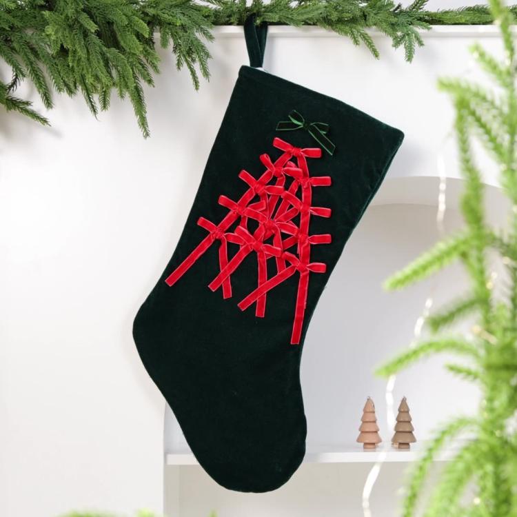 Large velvet Christmas stocking, dark green with red snowflake-style lattice and hanging loop