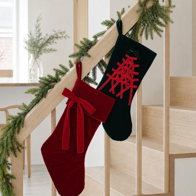 Set of large velvet Christmas stockings on stand, red and dark green with loop tops