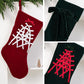 Large velvet Christmas stockings, red and dark green, each with lattice pattern and bow