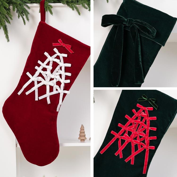Large velvet Christmas stockings, red and dark green, each with lattice pattern and bow