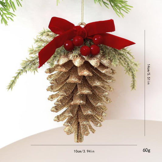 Gold glitter pinecone ornament with red velvet bow, red berry clusters, and hanging loop