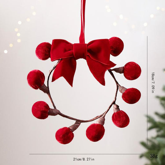 Red pom-berry grape-cluster wreath ornament with red ribbon bow