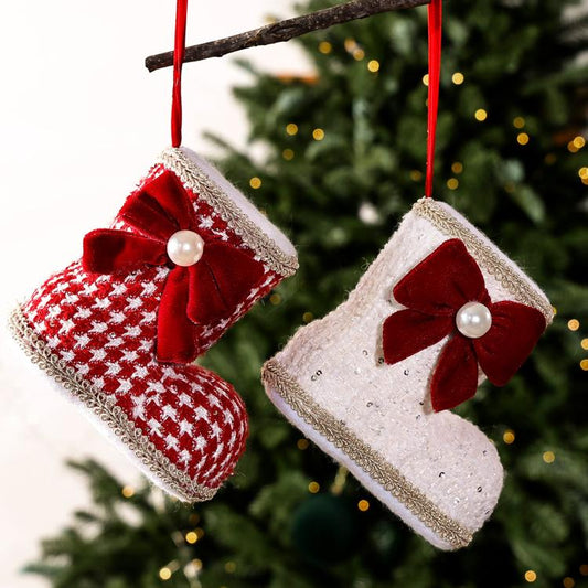 Pair of Christmas boot ornaments: red plaid and white, each with red velvet bow and pearl.