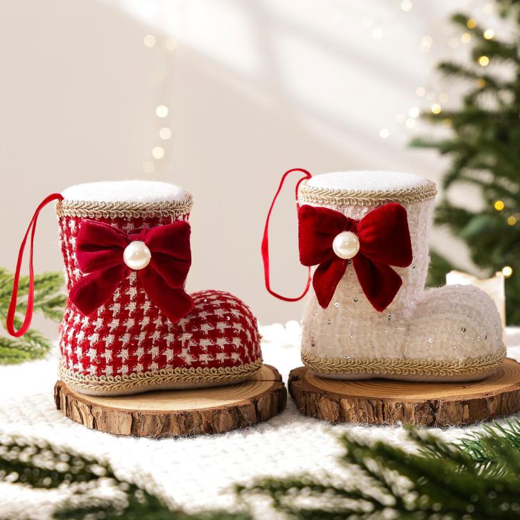 Two Christmas boot ornaments with gold trim; red plaid and white styles with pearl bows.