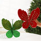 Velvet butterfly ornament set: one red and one dark green, with beaded glitter