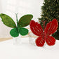 Velvet butterfly ornaments: dark green left and red right, with beaded glitter accents