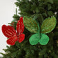 Velvet butterfly ornaments on a tree: red and dark green with beaded glitter trim