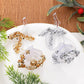 Clear acrylic rose ornament set with white and gold beaded rings, hanging loops