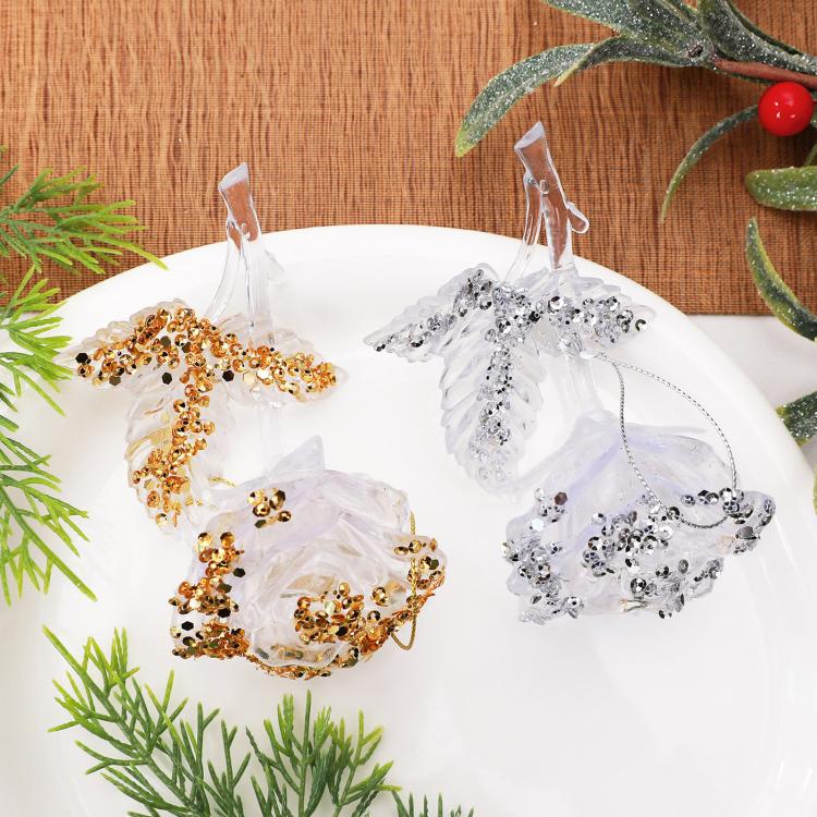 Clear acrylic rose ornament set with white and gold beaded rings, hanging loops