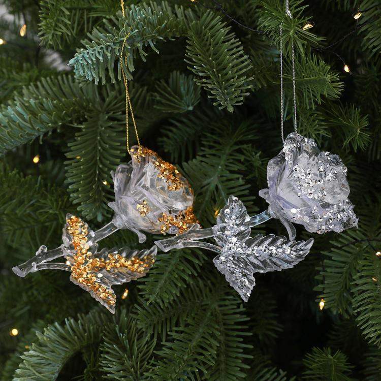 Clear acrylic rose Christmas ornaments on pine branches, gold and white beaded details
