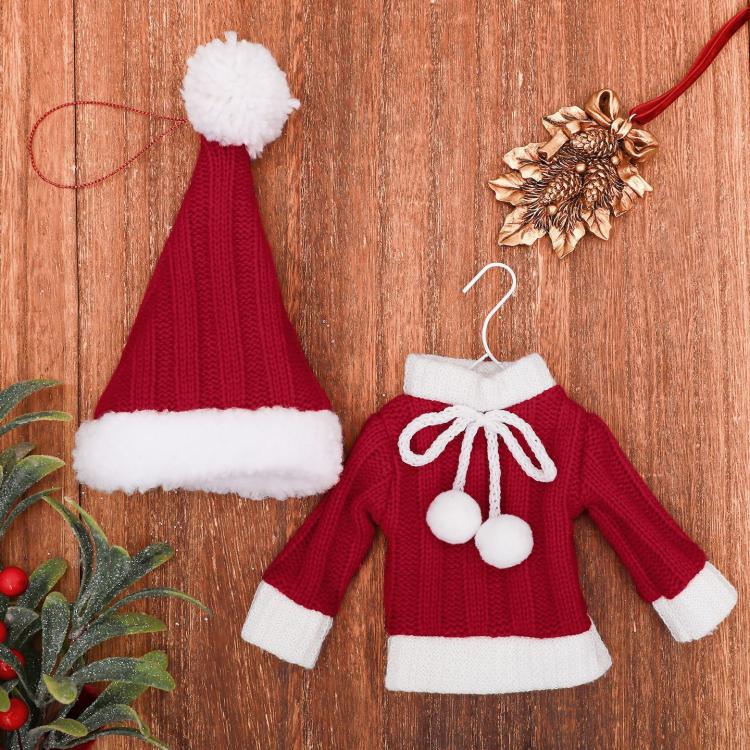 Mini knitted red sweater and red hat ornaments with white trim and hanging loops.