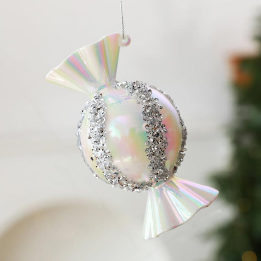 Iridescent white candy-shaped Christmas ornament with silver glitter trim and hanging loop