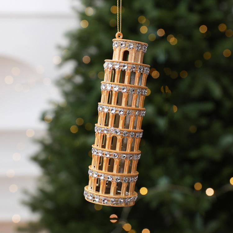Diamond-studded leaning tower ornament in gold with hanging loop and metallic accents