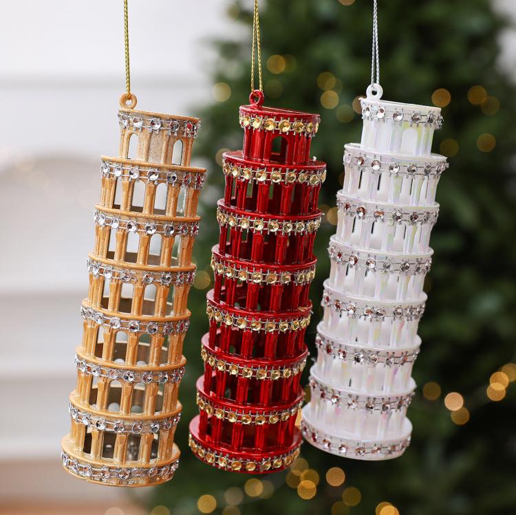 Diamond-studded leaning tower ornaments in gold, red, and white hanging with loops
