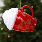 Red cup-shaped Christmas ornament with glittered white cap and red holiday text