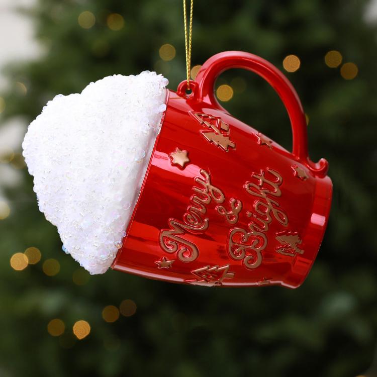 Red cup-shaped Christmas ornament with glittered white cap and red holiday text