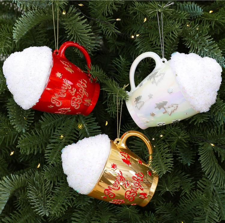 Cup-shaped Christmas ornaments in red, white, and gold with glittered caps on a tree