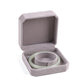 Gray octagonal velvet jewelry box, open with bracelet/bangle holder and jewelry inside
