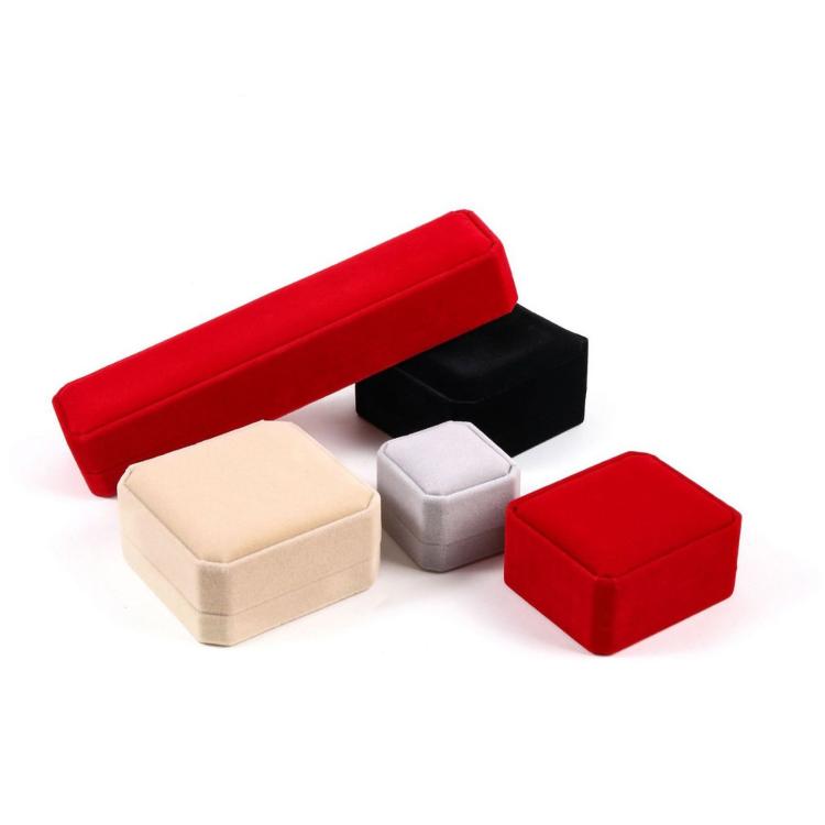 Red velvet jewelry box with multiple insert trays and ring box compartments
