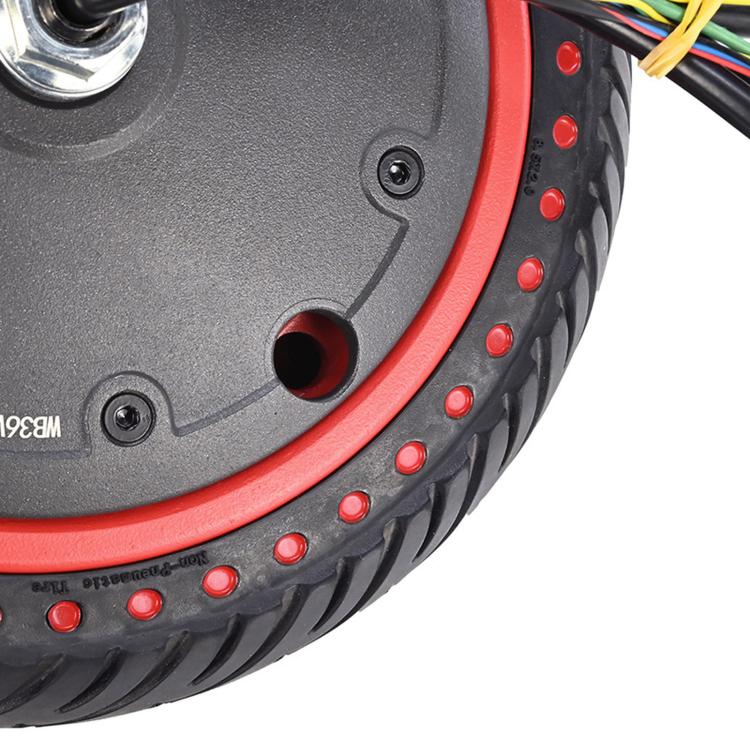 Scooter wheel tire side detail with red rim edge and studded tread