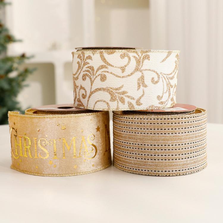 Set of Christmas ribbon rolls: gold filigree, gold “HRS CHRISTMAS”, and striped bands