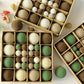 Flocked Christmas ball ornaments with hanging loops, assorted coffee brown, white, and green