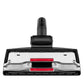 Vacuum floor brush head underside with two red strips and metal cleaning bar.