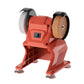 Red small bench grinder with two abrasive wheels and black safety guards
