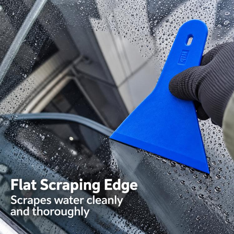 Blue window tint squeegee scraping water on wet car glass