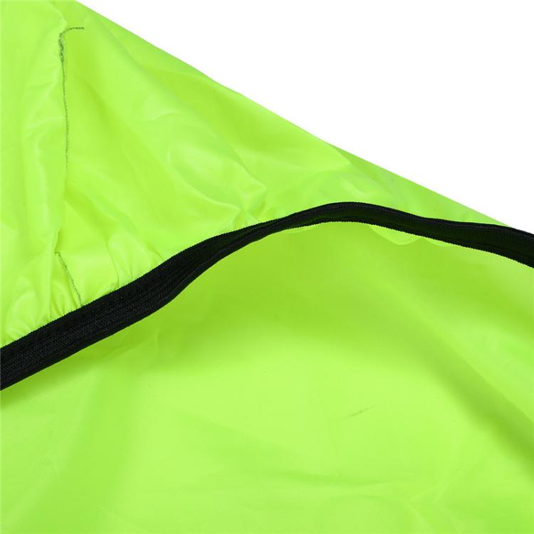 Neon green rain cover close-up with black piping seam and crinkled waterproof fabric