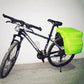 Neon green pannier cover fitted on rear rack with black trim and drawcord