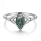 Green marquise agate centerpiece on a sterling silver leaf-detail band with small clear stones