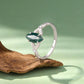 Sterling silver ring with green marquise agate and leaf-textured band, angled view