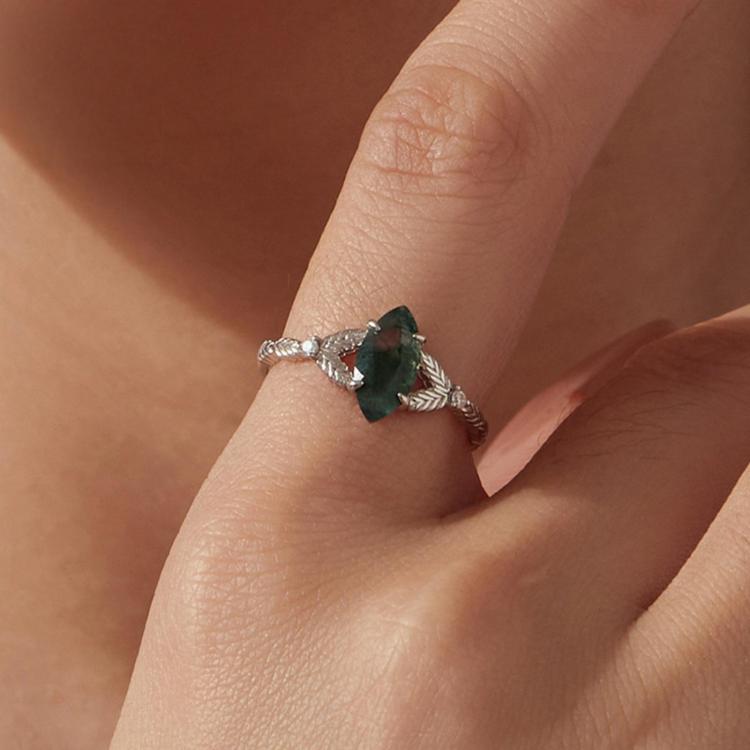 Green marquise agate sterling silver leaf ring worn on a finger