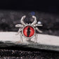 Sterling silver spider bead with red eye cabochon, raised legs and rounded bezel