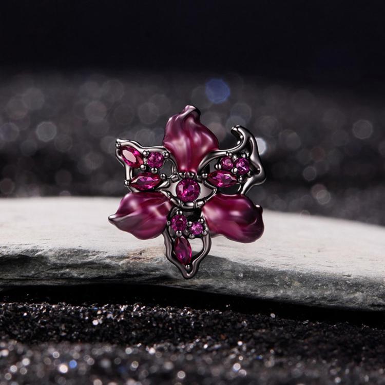 Gothic devil flower charm with magenta enamel petals and pink crystals, side view
