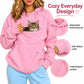 Pink pet-carrying hoodie with large kangaroo pouch, ribbed cuffs, and drawstring hood