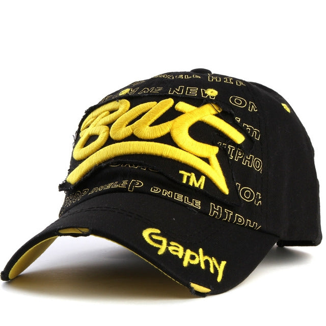 Black baseball cap with yellow embroidered letter pattern and curved brim